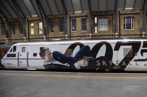 Today, a train named after Bond film SKYFALL was unveiled at King’s Cross Station. It’s the first time a film has permanently given its name to a train. The East Coast London to Edinburgh service, train number 91007, has been renamed SKYFALL with each of its eleven carriages wrapped in SKYFALL artwork.